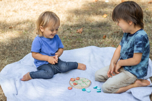 kids playing bug tic tac toe painted rocks epoxy ladybug lovebug bumblebee bee wood round picnic