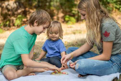 kids playing bug tic tac toe painted rocks epoxy ladybug lovebug bumblebee bee wood round picnic